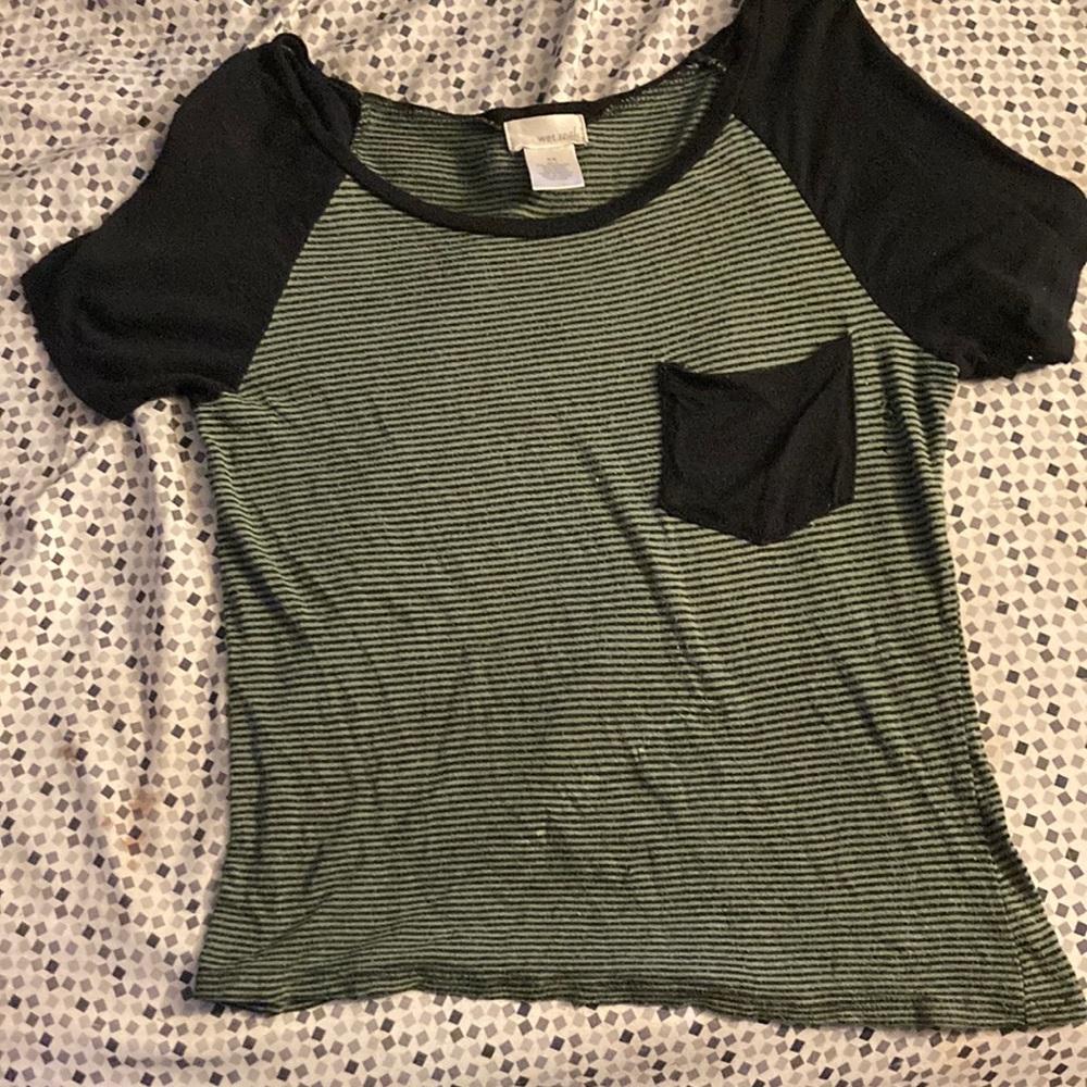 A Xs green and black shirt brand is wet seal